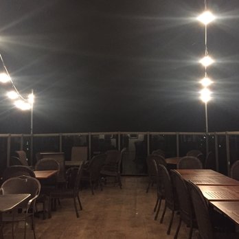 Teddys Barn And Grill - Outdoor seating at night. - American Near Me - Anamosa, Iowa