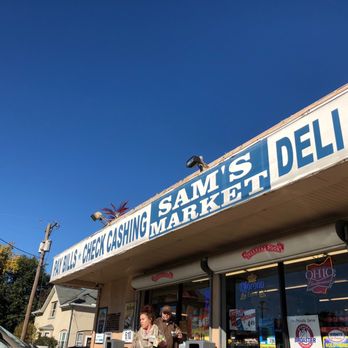 Sam Market - a man standing outside of a store - Grocery Near Me - Dayton, Ohio Sam Market - a man standing outside of a store - Grocery Near Me - Dayton, Ohio