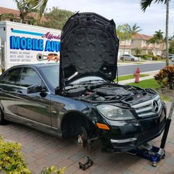 Affordable Mobile Auto Repair - replacing front brake pads and rotors