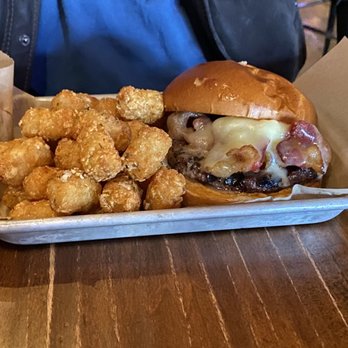 The Roost - The Roost Burger with seasoned tots. The local beef is seriously good and that cheddar is an awesome accent. - Pubs Near Me - Wellsboro, Pennsylvania