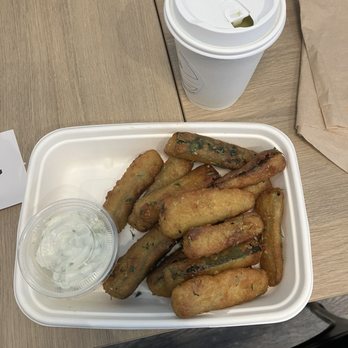 Hungry Zus - This is the zucchini fries i had. Alot of ppl would call them zucchini sticks. There was just the right amount of tzatizki sauce too. - Mediterranean Near Me - Vancouver, British Columbia