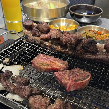 Yangmani - Garlic galbi in the middle / Mega galbi on either side - Korean Near Me - Rowland Heights, California Yangmani - Garlic galbi in the middle / Mega galbi on either side - Korean Near Me - Rowland Heights, California