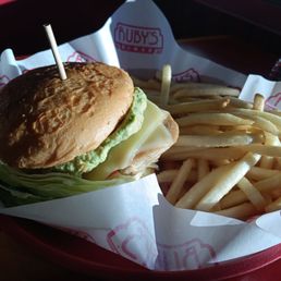 Guacamole burger with grilled chicken on a gluten free bun and regular fries Guacamole burger with grilled chicken on a gluten free bun and regular fries