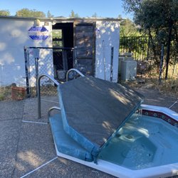 Old shed next to the dirty spa.