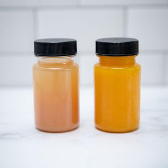 Juiced By B - two jars of orange juice - Juice Bars & Smoothies Near Me - Philadelphia, Pennsylvania