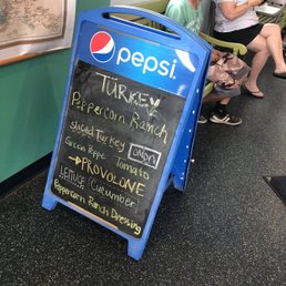 a pepsi sign in a restaurant