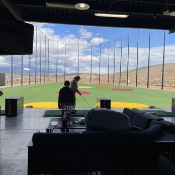 Crush Golf Plus Grill - two people playing golf - New American Near Me - St. George, Utah