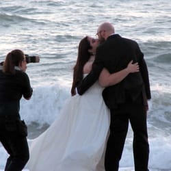 Kathryn Brass Photography - Camera-phone shot from a wedding guest, as Kathryn was taking our pictures along the beach at sunset.
