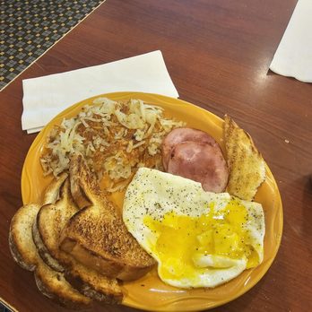 Yours Truly Restaurant - Sunrise breakfast  Perfectly cooked over medium eggs with Canadian bacon - American Near Me - Valley View, Ohio