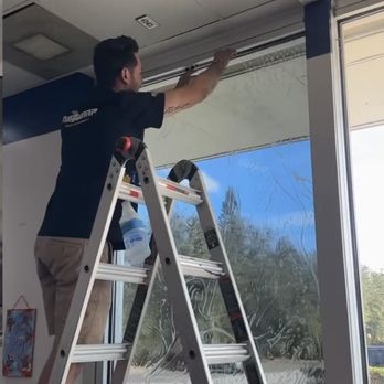 Elite Customz - Installing ceramic heat rejection film in the lobby at a local PepBoys - Car Window Tinting Near Me - Orlando, Florida Elite Customz - Installing ceramic heat rejection film in the lobby at a local PepBoys - Car Window Tinting Near Me - Orlando, Florida