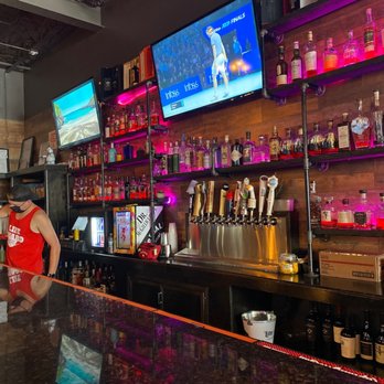 Whiskey Business - Holly Jolly Pop-up! - a man behind the bar - Whiskey Bars Near Me - Chicago, Illinois