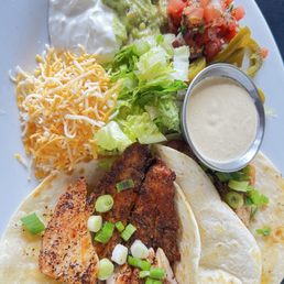 The blacked redfish tacos. The side toppings are what make these especially good because you're in control of what goes on your tacos. Yum! The blacked redfish tacos. The side toppings are what make these especially good because you're in control of what goes on your tacos. Yum!