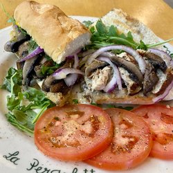 La Pergoletta Deli - CHICKEN PORTOBELLO PANINO:
Black label grilled chicken breast, sauteed Portobello mushrooms, and arugula (add ons:tomatoes and red onnion).