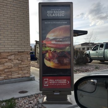 Wendy's - a sign for a burger restaurant - Fast Food Near Me - Herriman, Utah