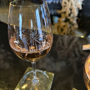 The Wine Garden - a glass of wine on a table - Wine Bars Near Me - Las Vegas, Nevada