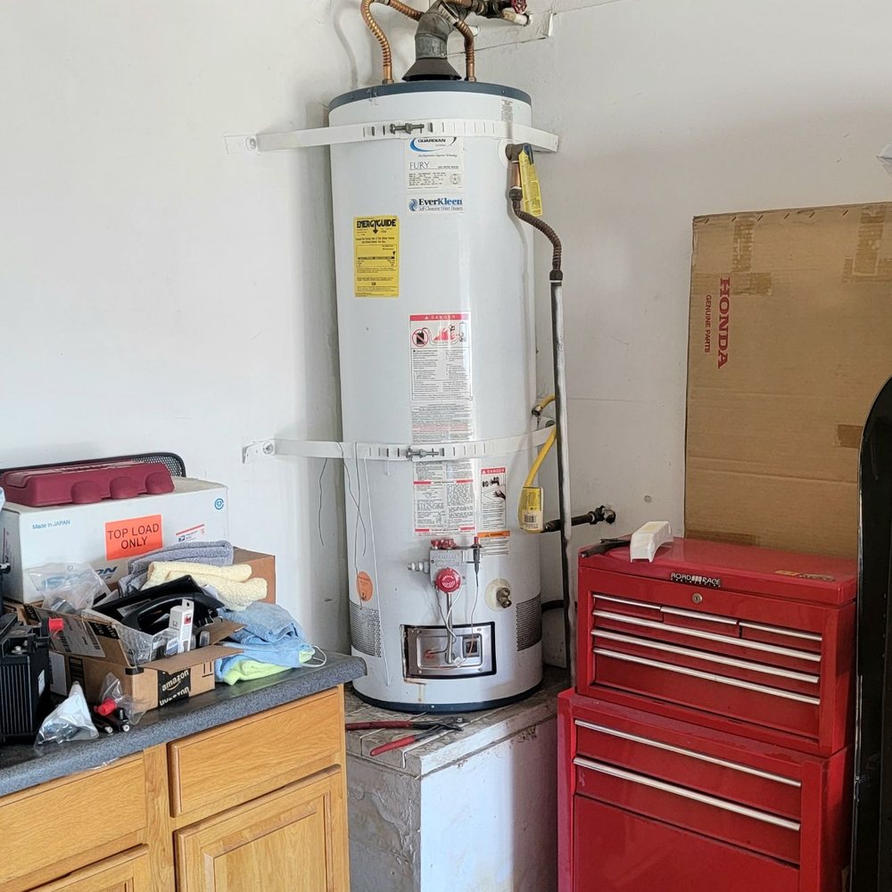Rasco Plumbing & Rooter - Old water tank with tons of water on the floor. - Plumbing Near Me - Santa Ana, California Rasco Plumbing & Rooter - Old water tank with tons of water on the floor. - Plumbing Near Me - Santa Ana, California