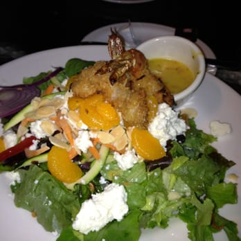 The Palm House - Coconut shrimp salad with mango dressing. - American Near Me - Juno Beach, Florida The Palm House - Coconut shrimp salad with mango dressing. - American Near Me - Juno Beach, Florida