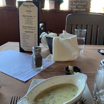 The Cork Tucson - Happy hour menu and empty escargot plate. - Steakhouses Near Me - Tucson, Arizona The Cork Tucson - Happy hour menu and empty escargot plate. - Steakhouses Near Me - Tucson, Arizona