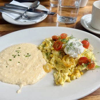 Cafe Flora - Corn and Heirloom Tomato Scramble with cheesy grits - Vegetarian Near Me - Seattle, Washington Cafe Flora - Corn and Heirloom Tomato Scramble with cheesy grits - Vegetarian Near Me - Seattle, Washington