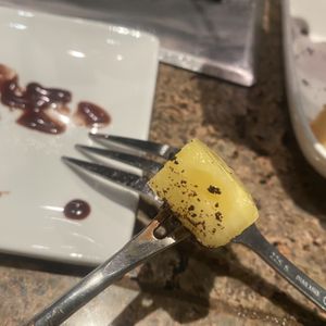 Photo of The Melting Pot - Wilmington, DE, United States. Super tiny pineapple chunk.