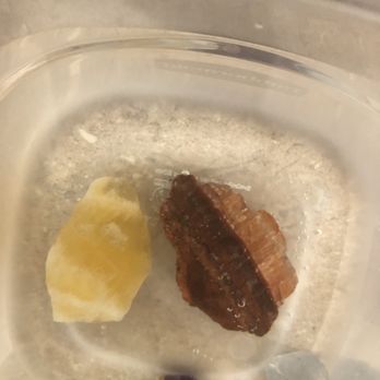Crystal Gallery Gem Center - Orange & red calcite, in water for cleansing before personal use. The two smaller stones were owned prior to my visit to the shop. - Jewelry Near Me - El Paso, Texas