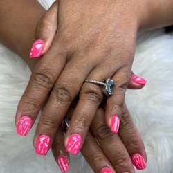 This was my nails today dipping powder and airbrush designs. Love it. I totally recommend this place.