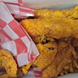 Four pieces of chicken tender and waffle fries