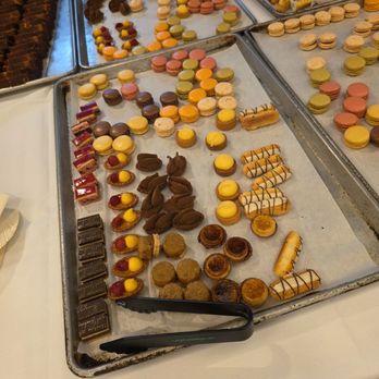 Crisp Catering - Assorted Desserts served on cookie baking sheets - Caterers Near Me