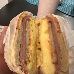 Pork roll egg and cheese with a hashbrown on a croissant Pork roll egg and cheese with a hashbrown on a croissant