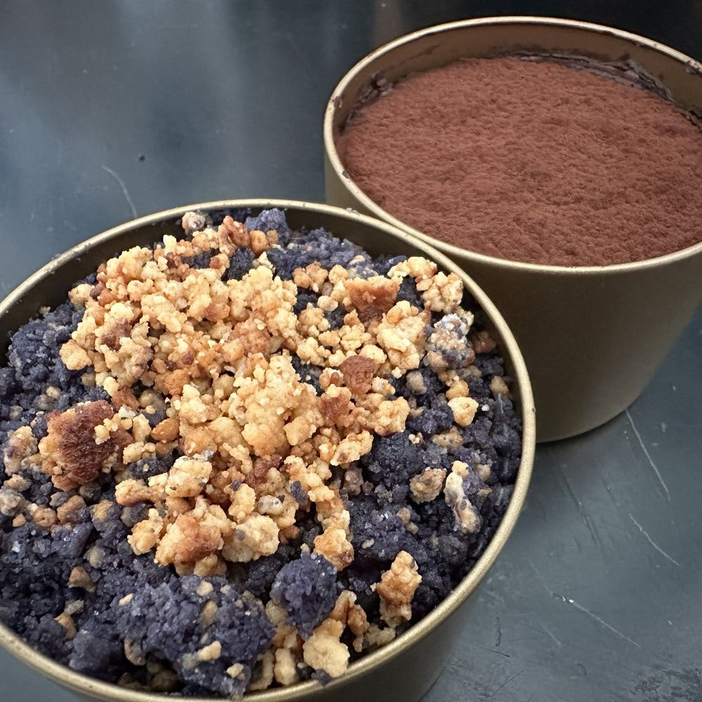 two bowls of chocolate pudding and a bowl of crumbs two bowls of chocolate pudding and a bowl of crumbs