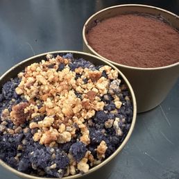 two bowls of chocolate pudding and a bowl of crumbs two bowls of chocolate pudding and a bowl of crumbs