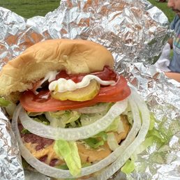 a large sandwich wrapped in tin foil a large sandwich wrapped in tin foil