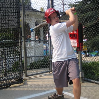 Putterz - a batter in the batting cage - Mini Golf Near Me - Ypsilanti, Michigan Putterz - a batter in the batting cage - Mini Golf Near Me - Ypsilanti, Michigan