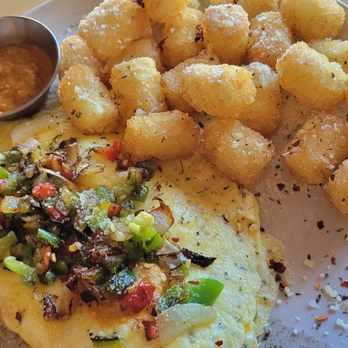 Mevan Coffee& Breakfast - Delicious cheese omelette, with a bonus ramikan of romesco sauce to go with the tots. Everything was superb! - Coffee Roasteries Near Me - San Diego, California