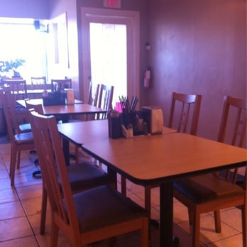 Vietnamese Garden - a table and chairs in a restaurant - Vietnamese Near Me - Calgary, Alberta Vietnamese Garden - a table and chairs in a restaurant - Vietnamese Near Me - Calgary, Alberta