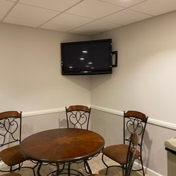 T.V. mounted on wall to stream photos with background music honoring my Dad, a nice touch.