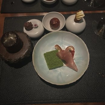 Aubergine - Olive oil cake with cream, strawberry glass, dried and fresh strawberries, ice cream, pluot fritter, truffle, mousse cake. - New American Near Me - Carmel, California