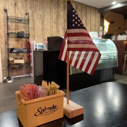 ows a small american flag on a table ows a small american flag on a table