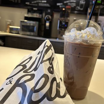 Bitty & Beau’s Coffee - Iced mocha with whipped cream and cake pop in the bag - Coffee & Tea Near Me - Annapolis, Maryland