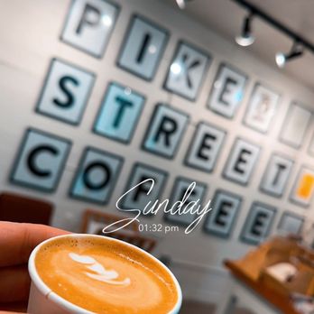 Pike Street Coffee - a person holding a cup of coffee - Coffee & Tea Near Me - Seattle, Washington Pike Street Coffee - a person holding a cup of coffee - Coffee & Tea Near Me - Seattle, Washington