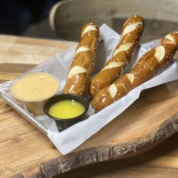 DoubleTap KC - Bavarian-style pretzel sticks with warm house-made queso and Dijon mustard.