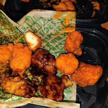 Wingstop - So I tried to grab the waxed paper my wings were on and everything just fell it was not packed right to begin with. - Chicken Wings Near Me - Clifton Park, New York