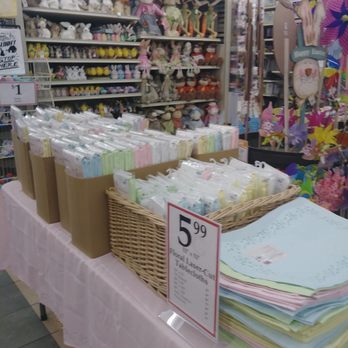 Christmas Tree Shops - Display table with laser cut floral table cloths - Home Decor Near Me - Mishawaka, Indiana