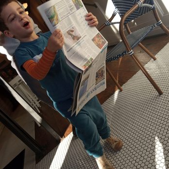 La Boulange - Art deco floor. Little man reading the newspaper upside down, taking a break from his hot chocolate and almond croissant. - Bakeries Near Me - Garland, Texas La Boulange - Art deco floor. Little man reading the newspaper upside down, taking a break from his hot chocolate and almond croissant. - Bakeries Near Me - Garland, Texas