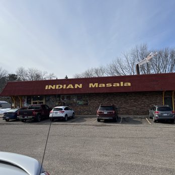 Indian Masala - Outside and parking lot of restaurant. Watch out for the pit holes - Indian Near Me - Maplewood, Minnesota