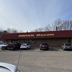 Indian Masala - Outside and parking lot of restaurant. Watch out for the pit holes