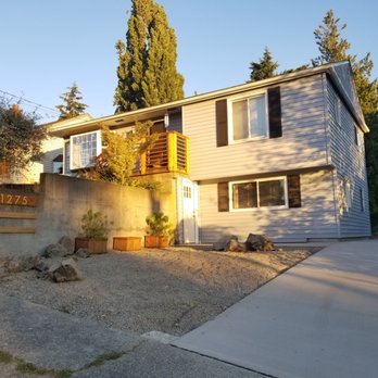 3 Guys Construction - "AFTER" parking pad demo, new driveway and sidewalk to our lower door. They left me the boulders they torn out from landscaping by request. - General Contractors Near Me - Seattle, Washington 3 Guys Construction - "AFTER" parking pad demo, new driveway and sidewalk to our lower door. They left me the boulders they torn out from landscaping by request. - General Contractors Near Me - Seattle, Washington