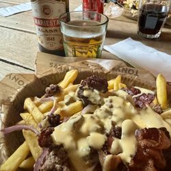 tonys pizzaria - The Garage:  ground chuck with bacon, red onions and jalapeños served on fries and topped with a cheese sauce.