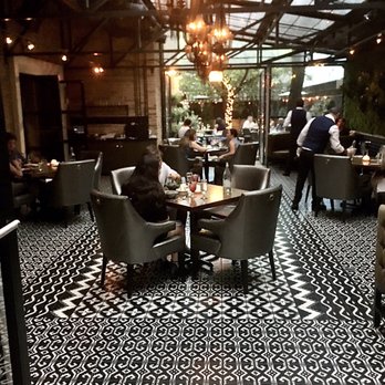 Boka - Boka Interior. The staff is mindful of maintaining social distance with their indoor seating. - New American Near Me - Chicago, Illinois