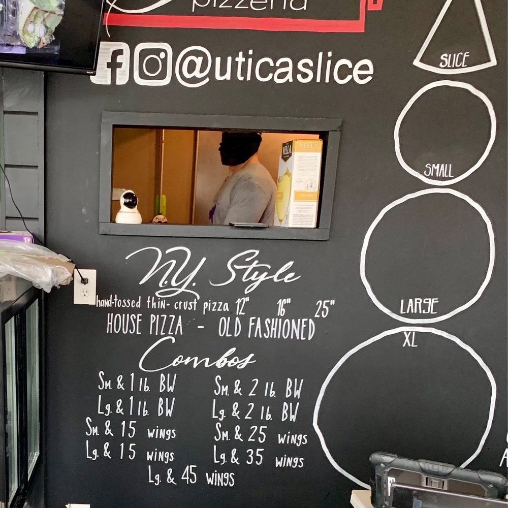Slice Pizzeria - a menu on the wall - Pizza Near Me - Utica, New York
